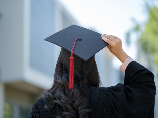 A graduate wearing a mortarboard