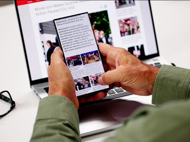 Someone reads the news on their phone