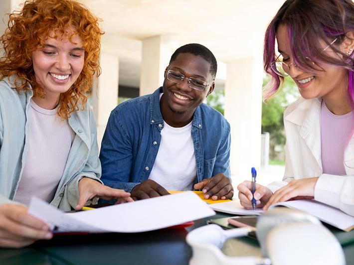 Group of happy multiracial university students