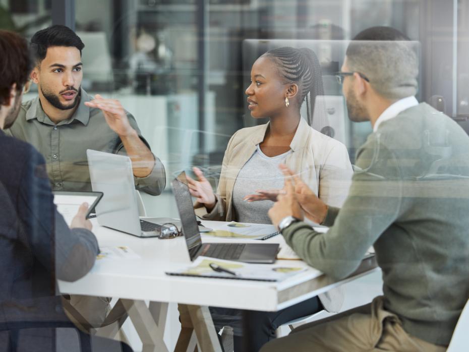 An interdisciplinary team discussing a project 