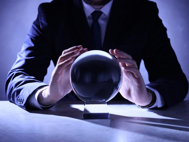 A man in a suit with a crystal ball