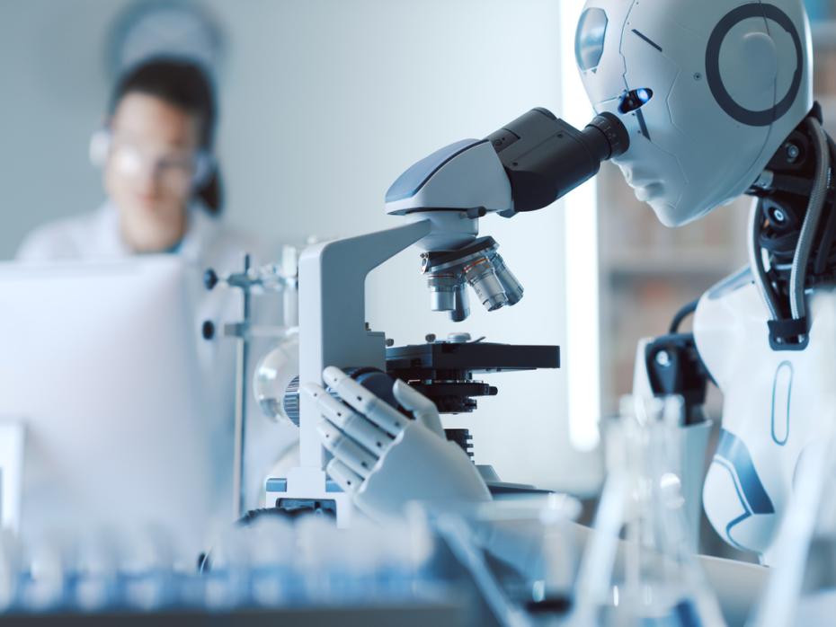 A robot uses a microscope in a laboratory