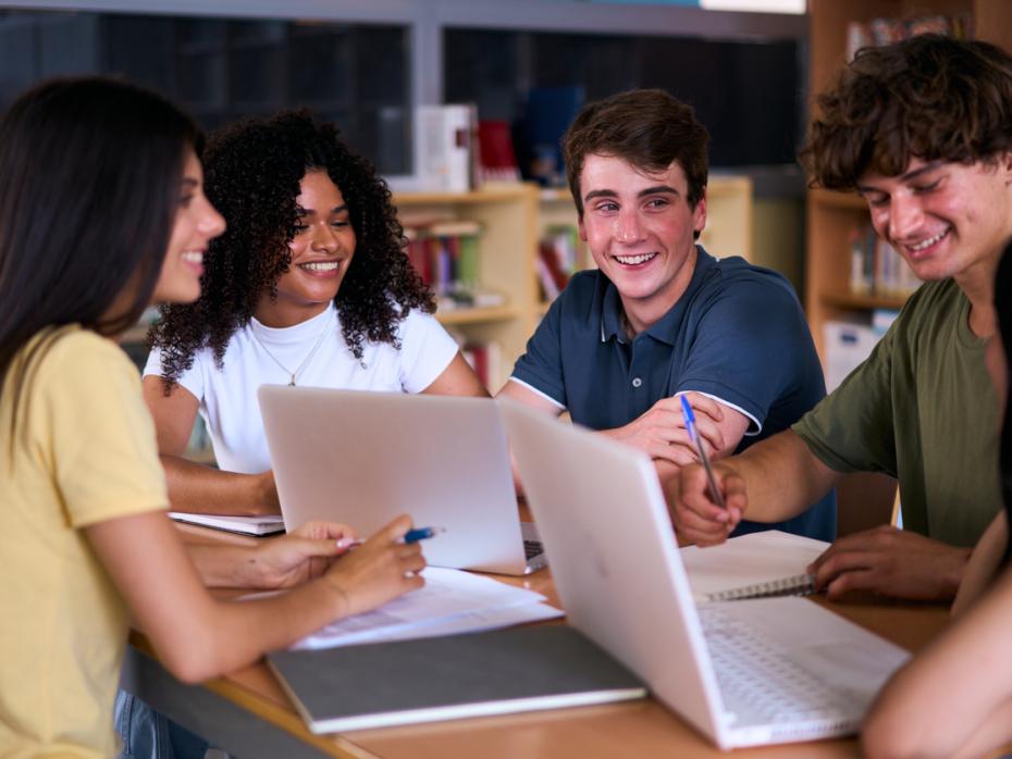 A group of university students working together at a table
