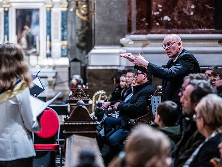 Man conducting a choir and orchestra