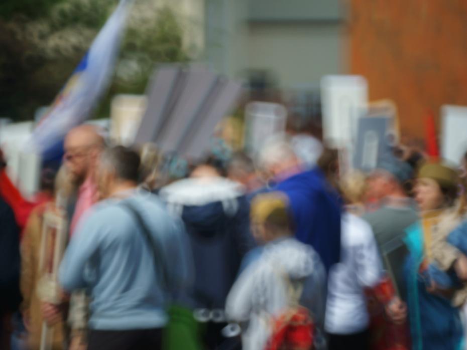 Blurred protestors carrying signs