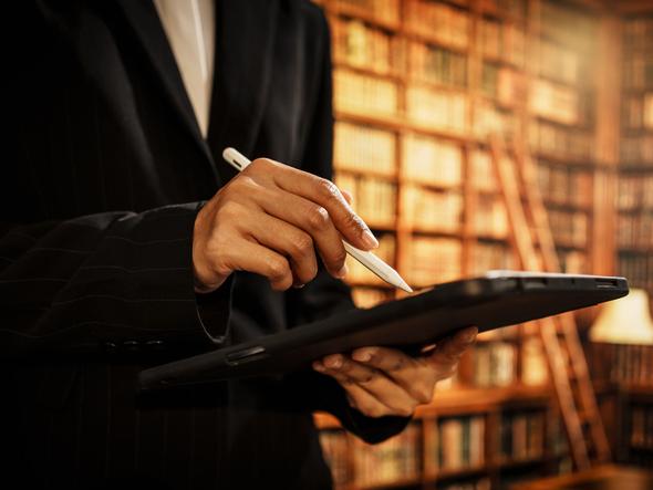 A librarian uses a tablet