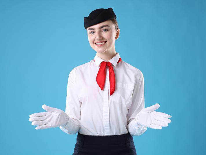 Flight attendant demonstrating safety procedures against blue background