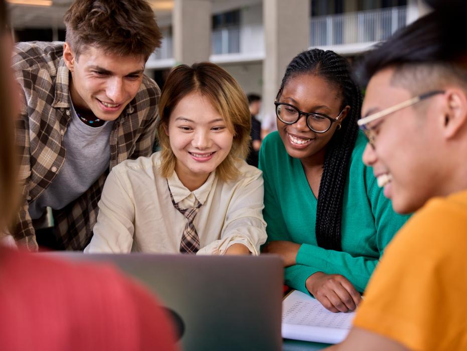 Five university students working on a group project in class