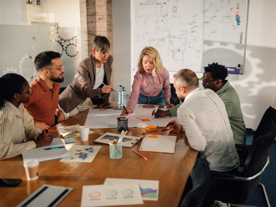A team brainstorming around a large table