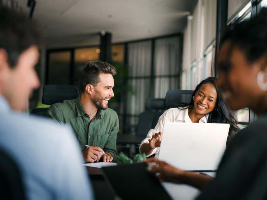 A team of professional services staff haveing a discussion