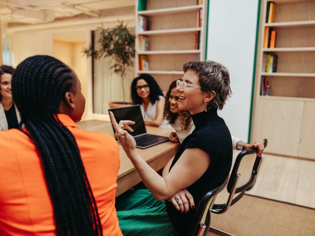 Academics discuss ideas in a meeting