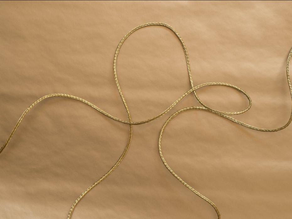 A golden thread against a brown background