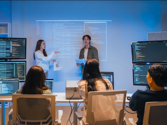Two academics lead a coding session