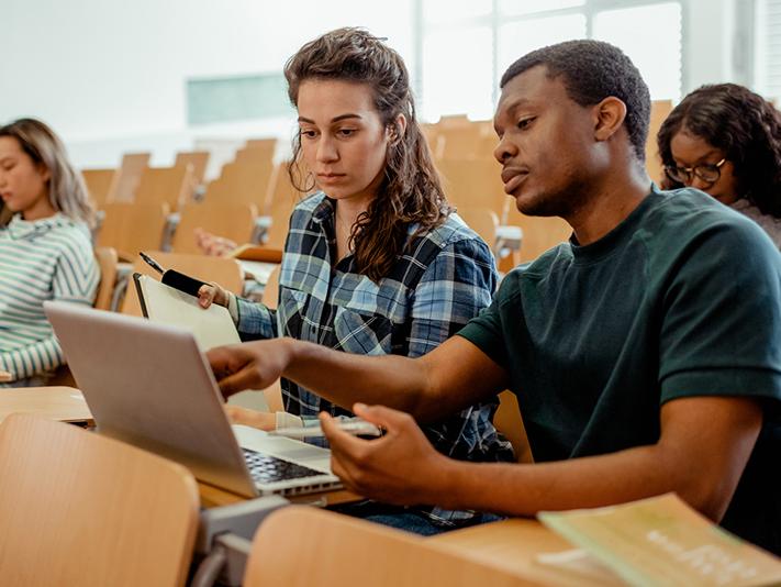 Students doing pairwork in a lecture