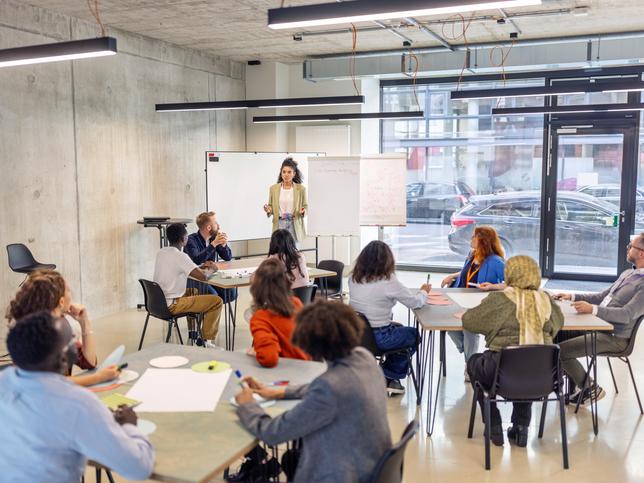 An academic leading seminar activities with flipchart 
