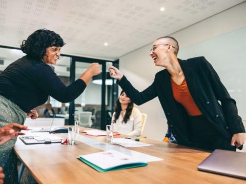 Two women demonstrating successful teamwork