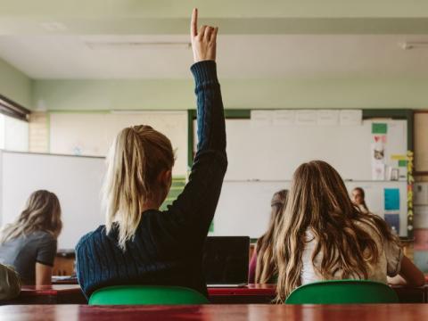 Students responding to a question in the classroom