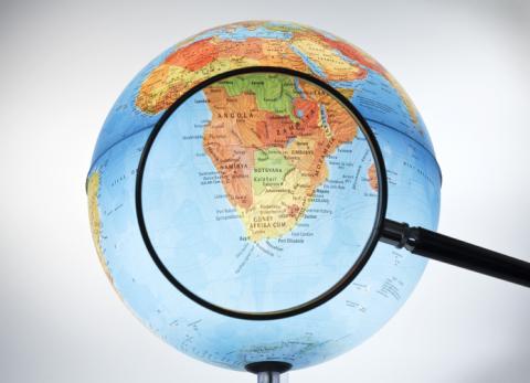 Magnifying glass over southern Africa on a globe