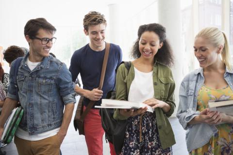 A group of college students swapping notes