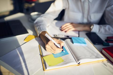 Young woman planning work schedule