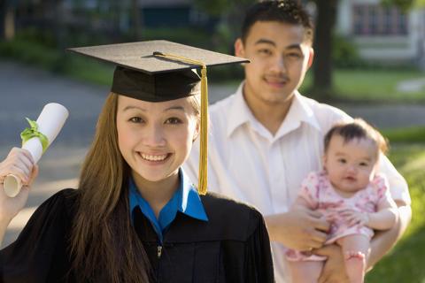 Young Asian female graduate with baby and partner