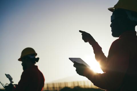 Two scientists working on a windfarm