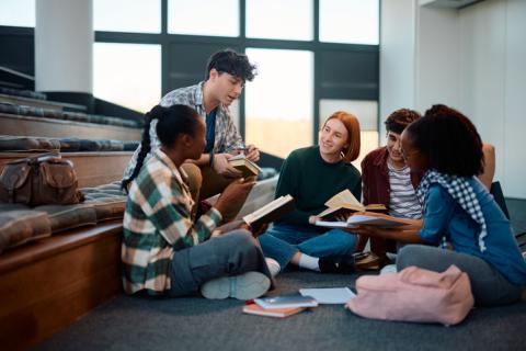 Students chat in a lecture hall