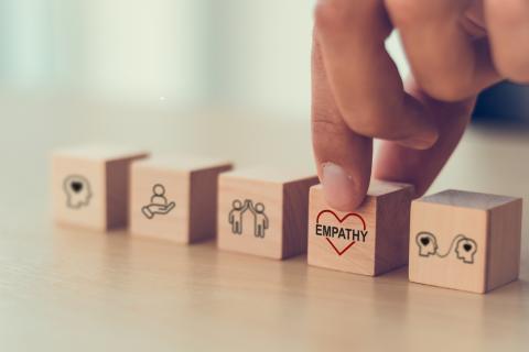 Wooden blocks, one with the word "empthy" inscribed on it