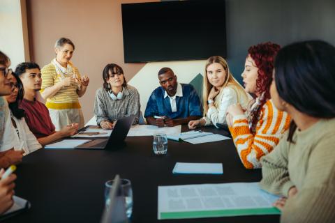 Students and a teacher having a discussion in the classroom