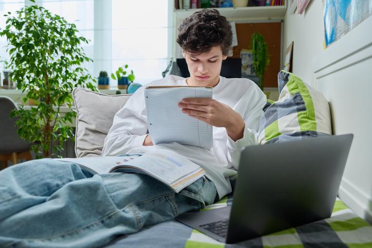 Student doing open-book test at home