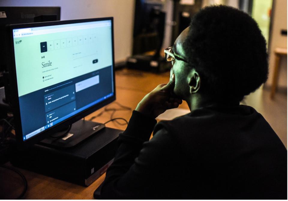 Woman looking a digital art project on computer