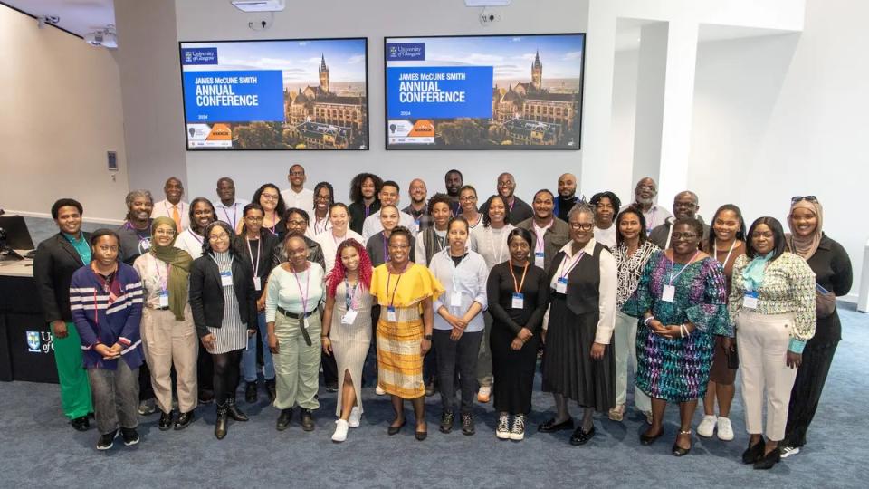 Members of the JMS programme smling at the camera