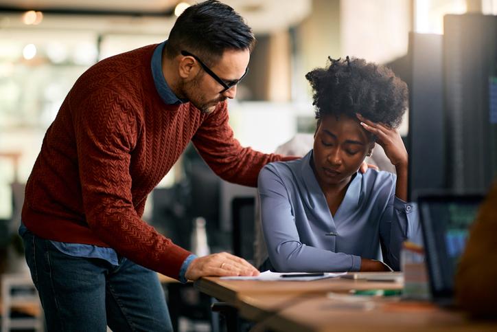 An educator comforts a distressed student