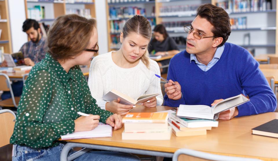 A tutor helping her postgraduate students