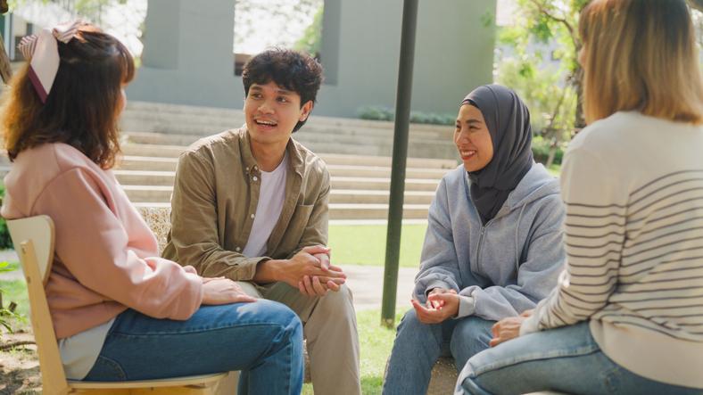 A group of students sat in a circle having a discussion