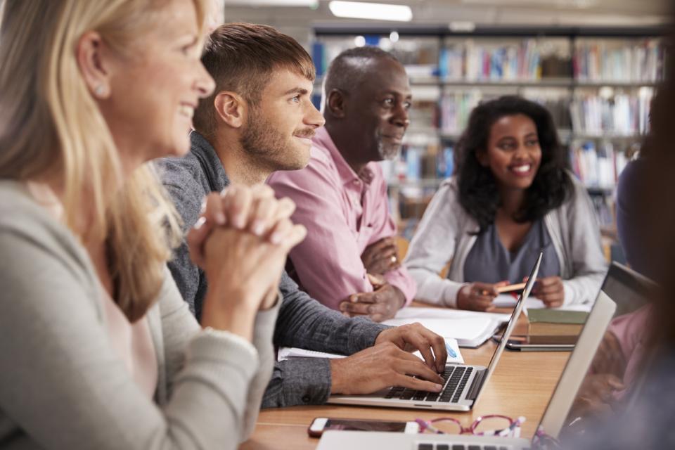 Students and staff on laptops