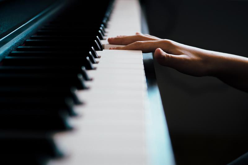 Hand playing piano