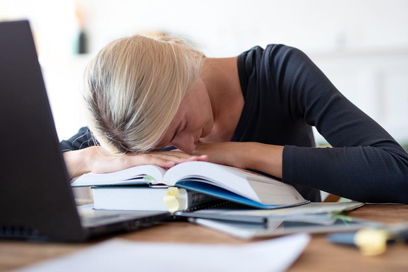 Woman sleeping at desk