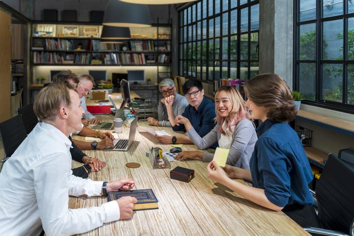 A group of students work round a table