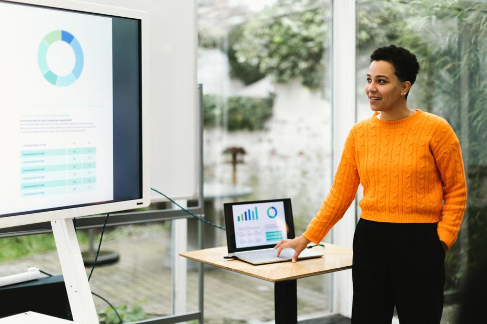 A teacher giving a PowerPoint presentation