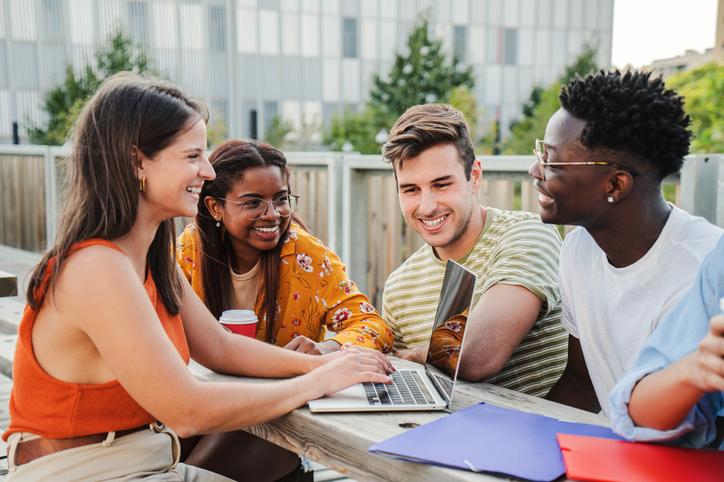 Students work together in an outdoor setting