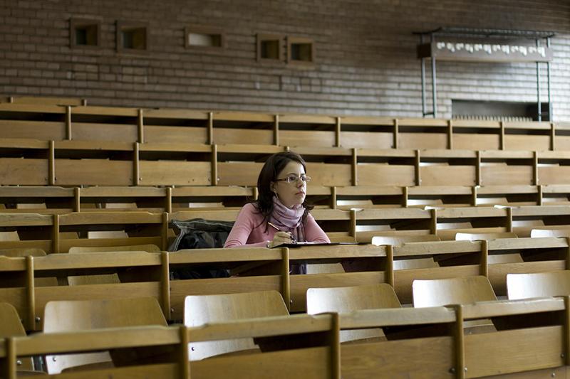 Female students sitting along in lecture hall