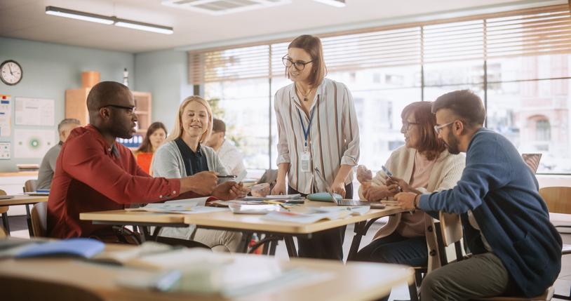 A teacher guides students through an activity