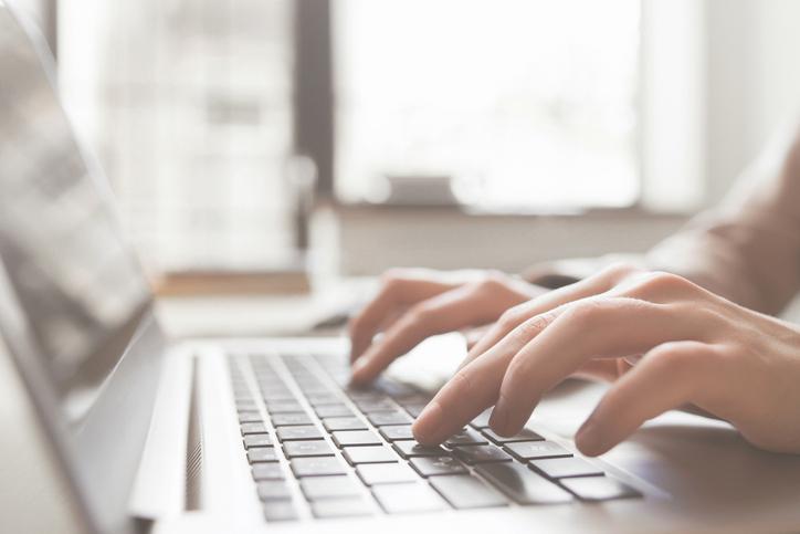 Fingers typing at a keyboard