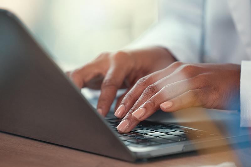 Doctor using laptop