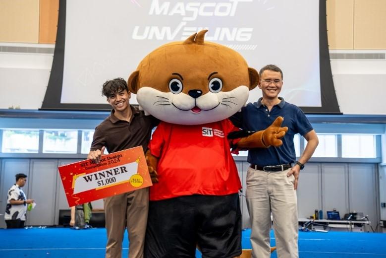 Sebastian (left), a Year 2 student in Applied Artificial Intelligence, with his winning creation, OTi (Overcoming Through Innovation), and Professor John Thong, Deputy President (Academic) & Provost, SIT. Photo: SIT