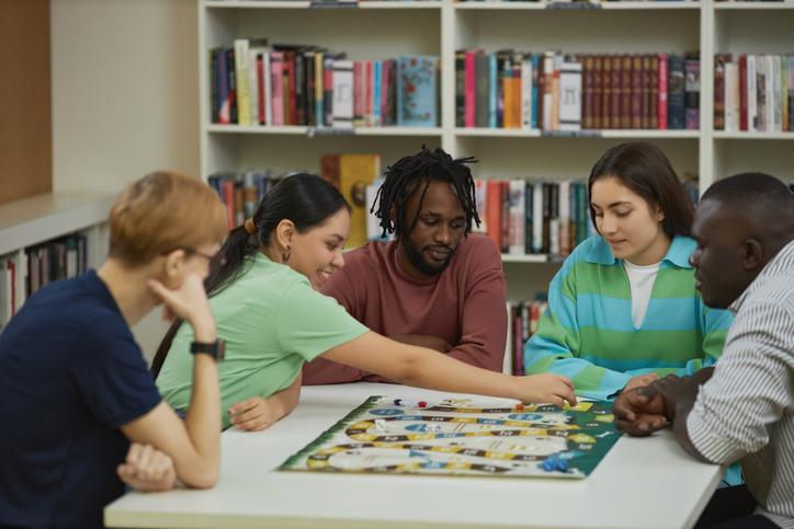 Students playing a boardgame 