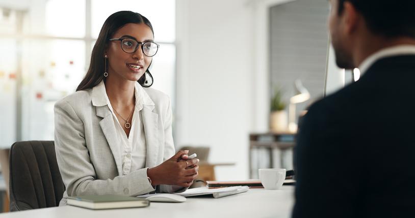 A young woman interviews for a job