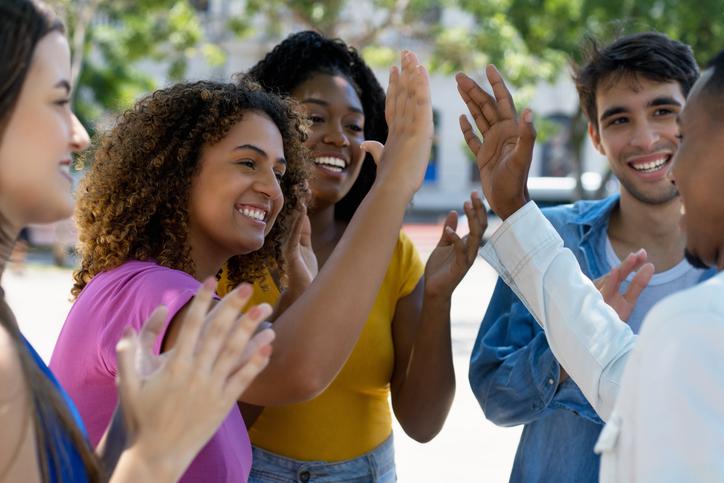 Students high five