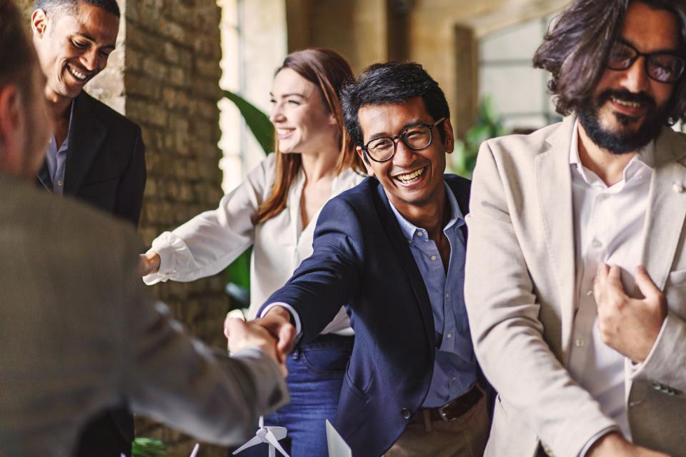 Corporate representatives shaking hands